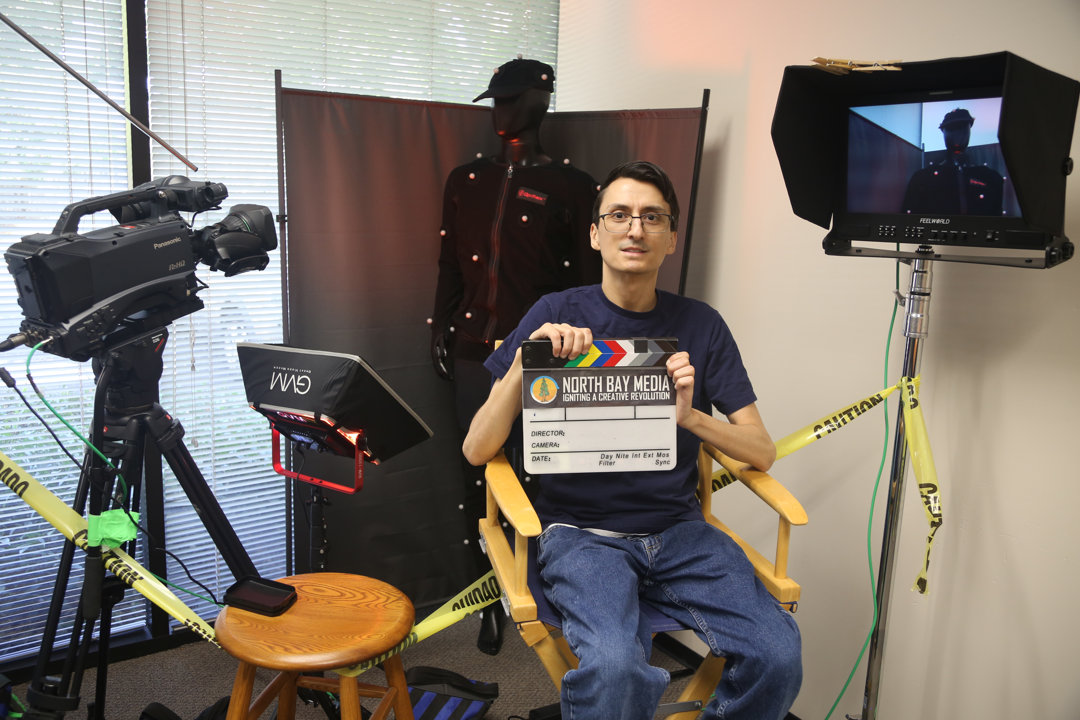 Man in Directors chair
