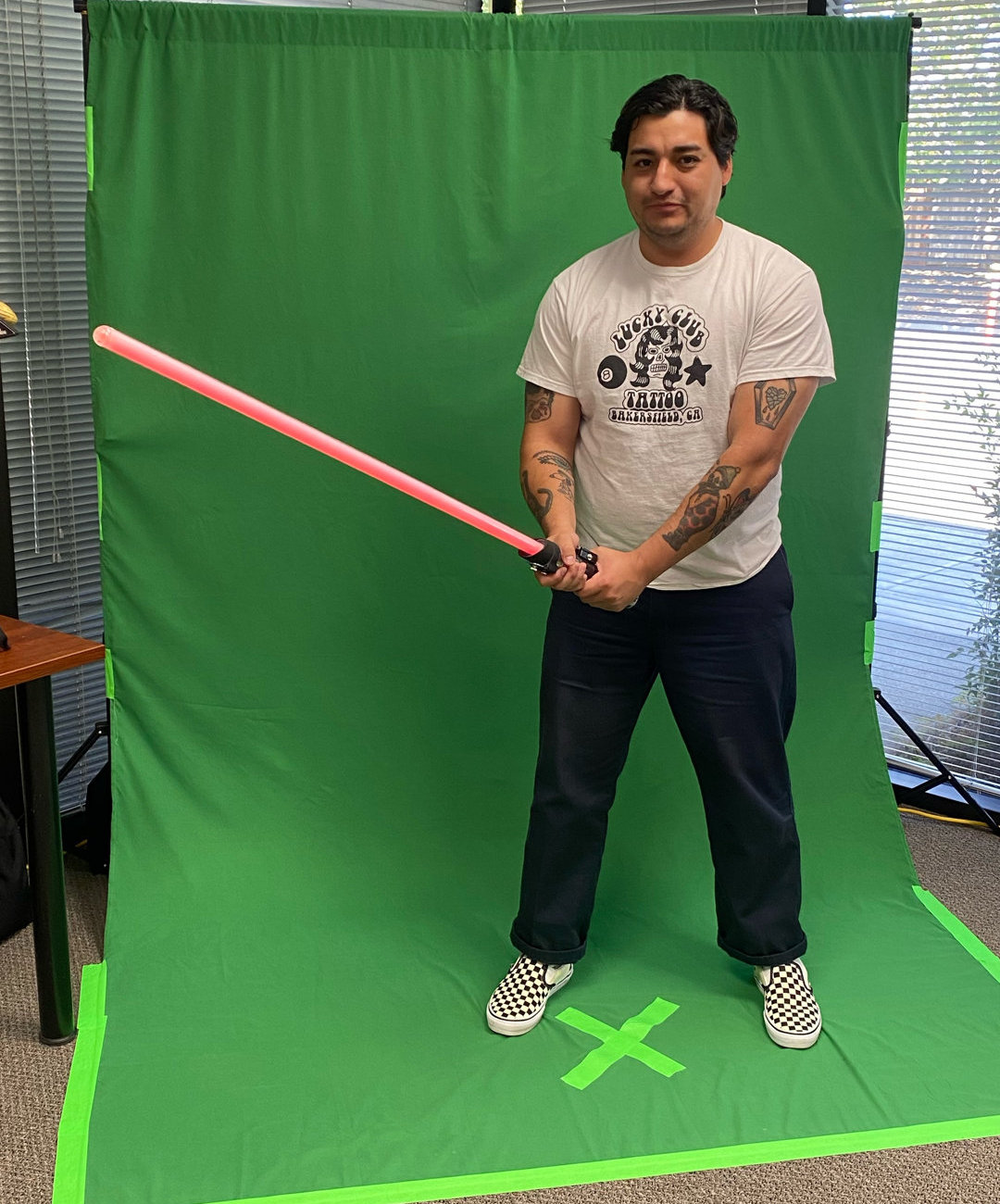 Person Holding Lightsaber