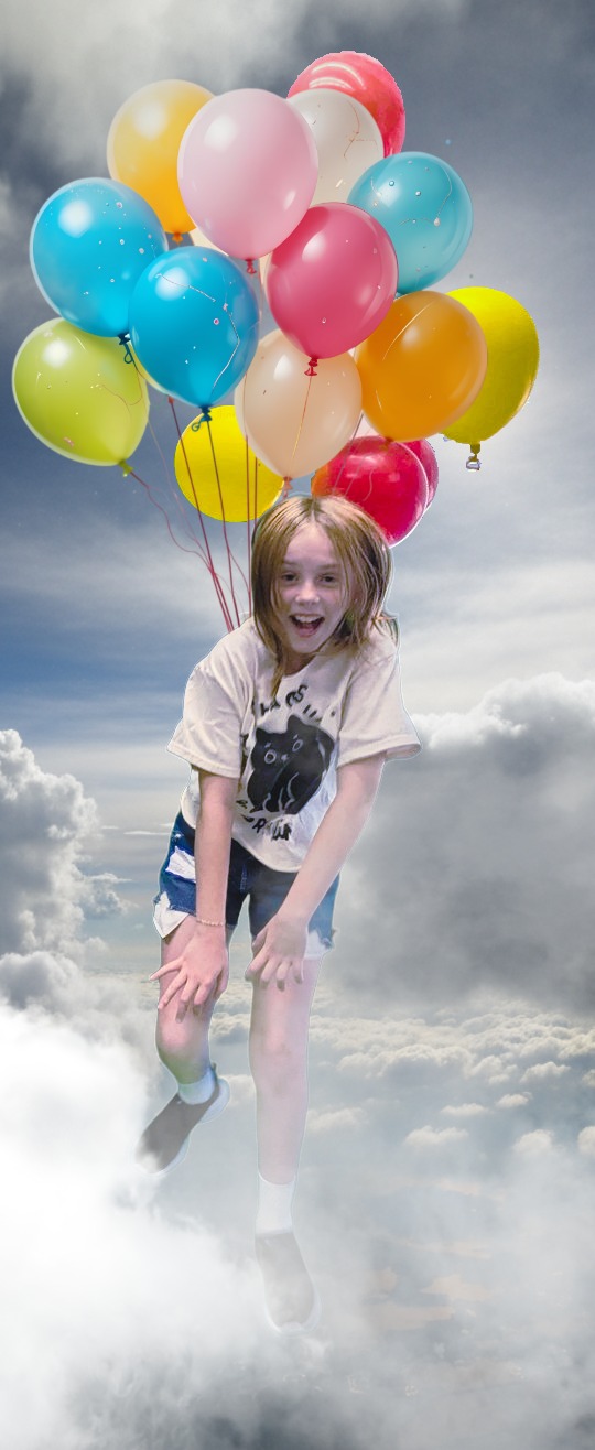 Girl jumping with balloons