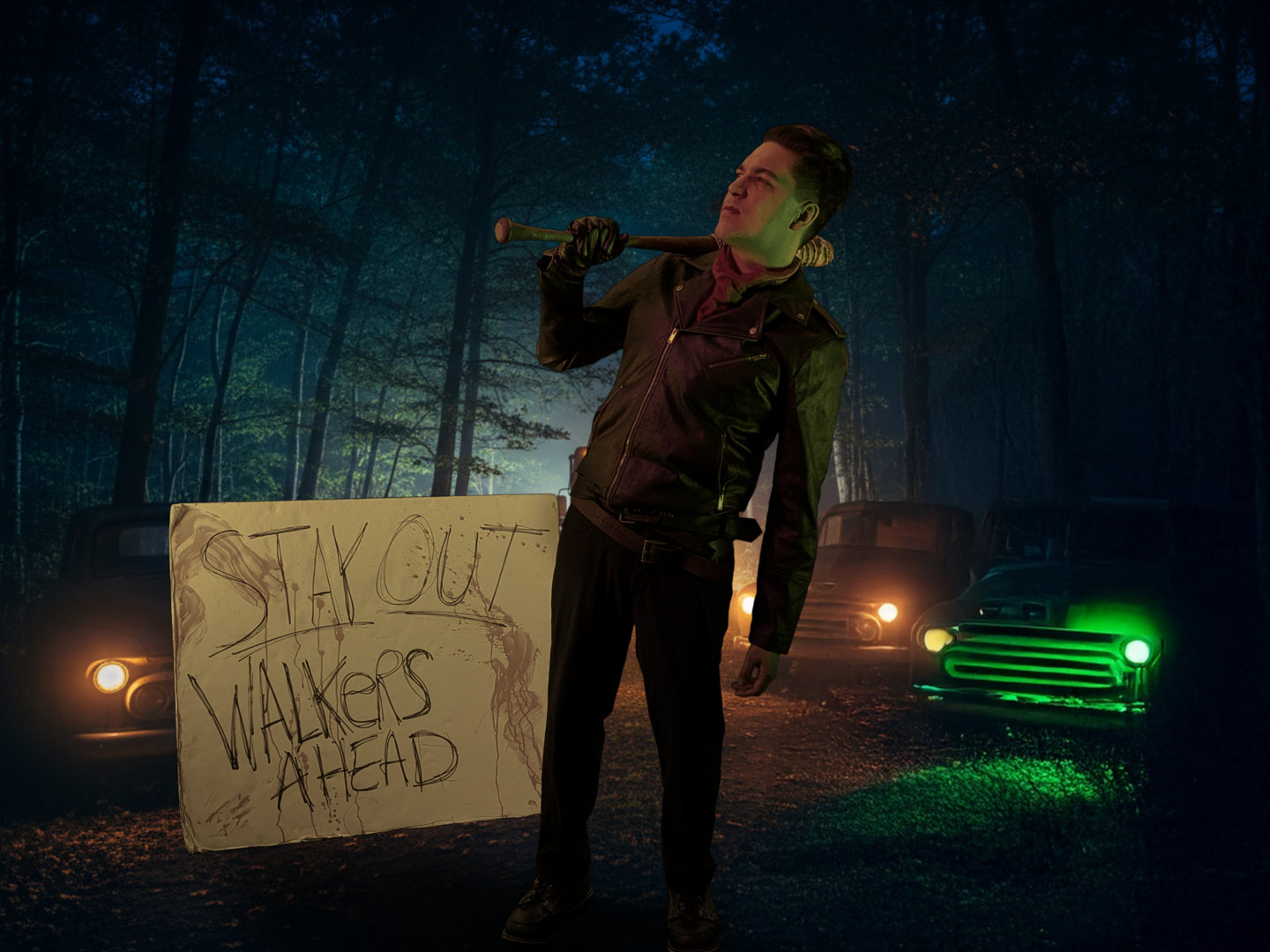 guy, neegan, standing in front of a sign pointing a bat at it